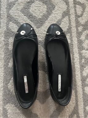 BCBGeneration Black Bow Ballet Flats with Silver Accent
